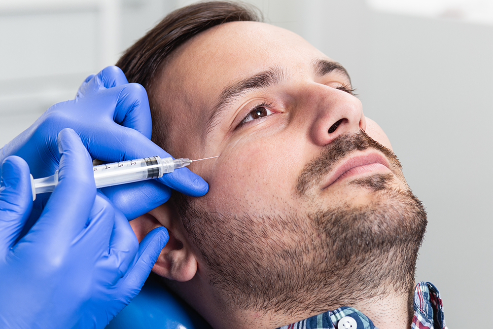 A woman receiving a Morpheus8 treatment on her face